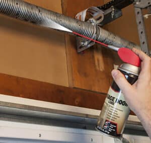 applying silicone garage door lubricant
